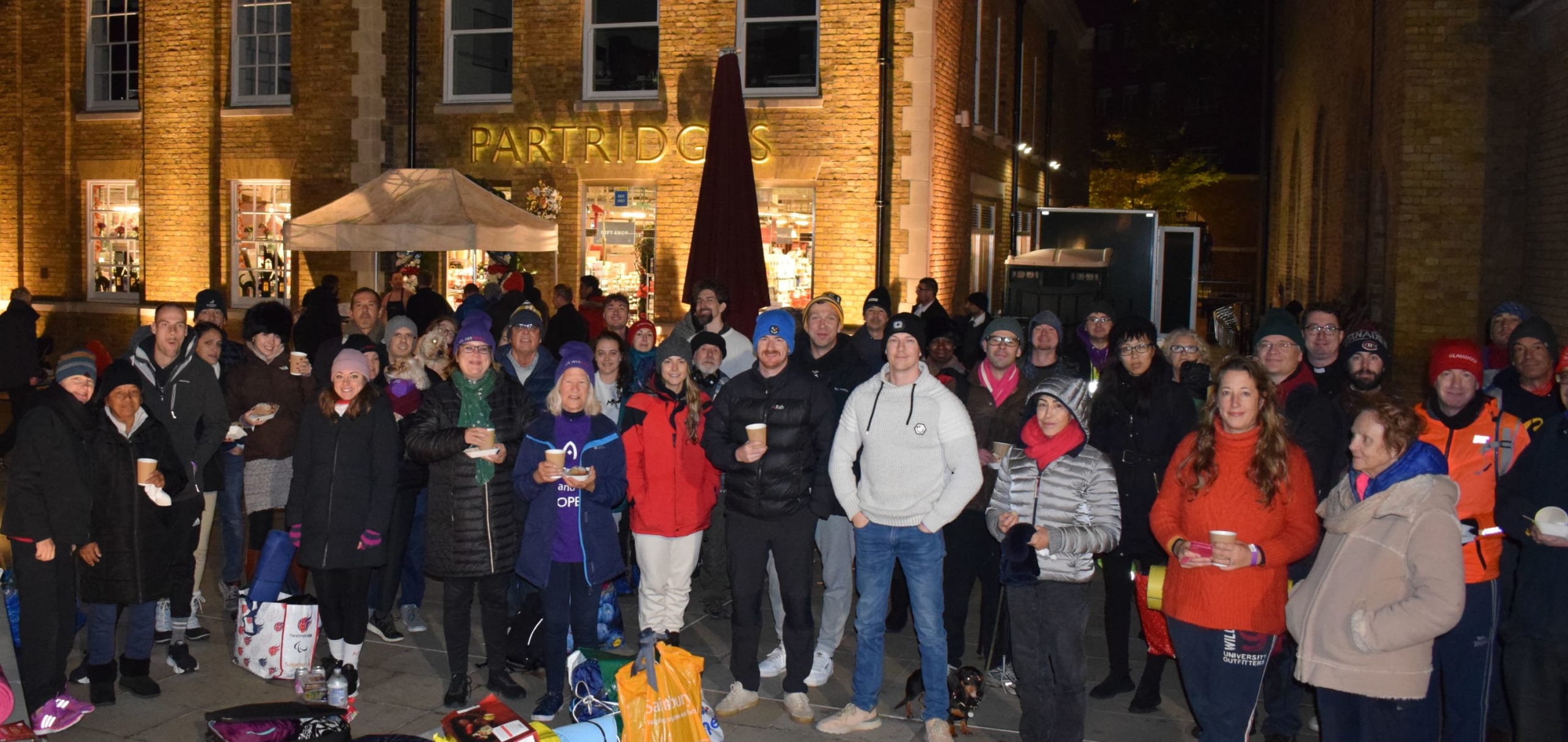 All the sleepers from the 2022 Sleep Out standing in front of Partridges