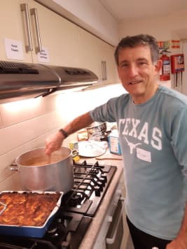 Trevor Huggins making lasagna